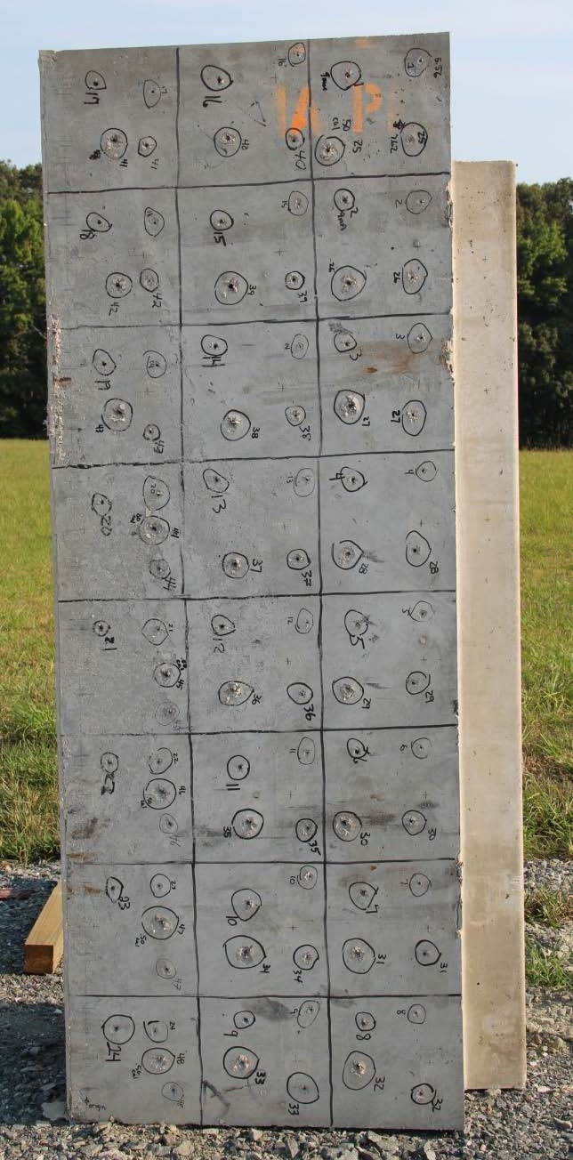 An ABC wall panel after certification-round penetration testing, marked with a grid of numbered impact points