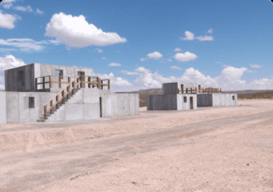 Rendering of a modular ballistic concrete training compound built from ArmorBlock components