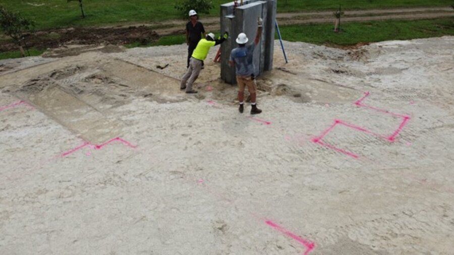 Field crew staking out a live-fire training facility site before construction