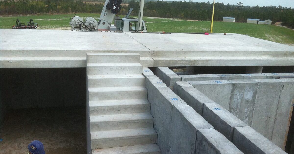 Precast ballistic concrete walls and stairs of a live-fire training structure under construction