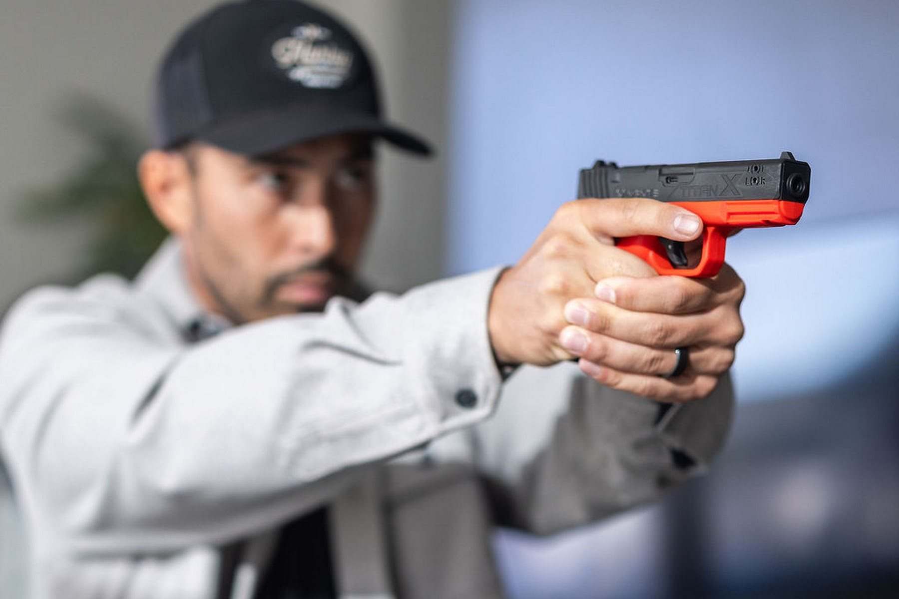 Shooter using a Mantis inert training pistol during a marksmanship exercise