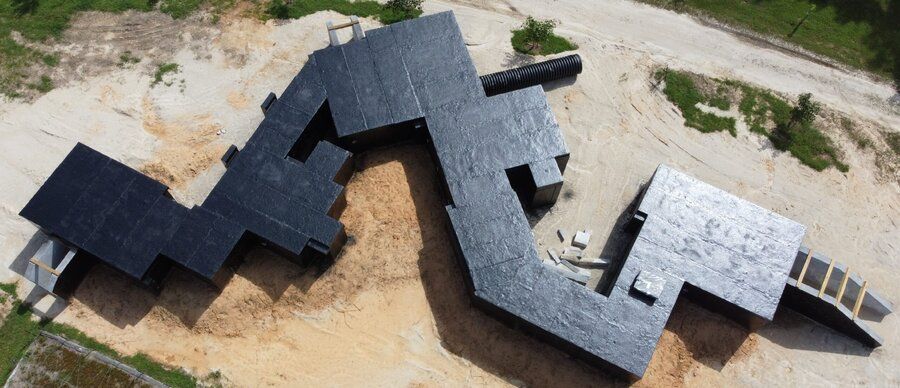 Aerial view of a completed sub-terranean live-fire training facility roof structure in North Carolina
