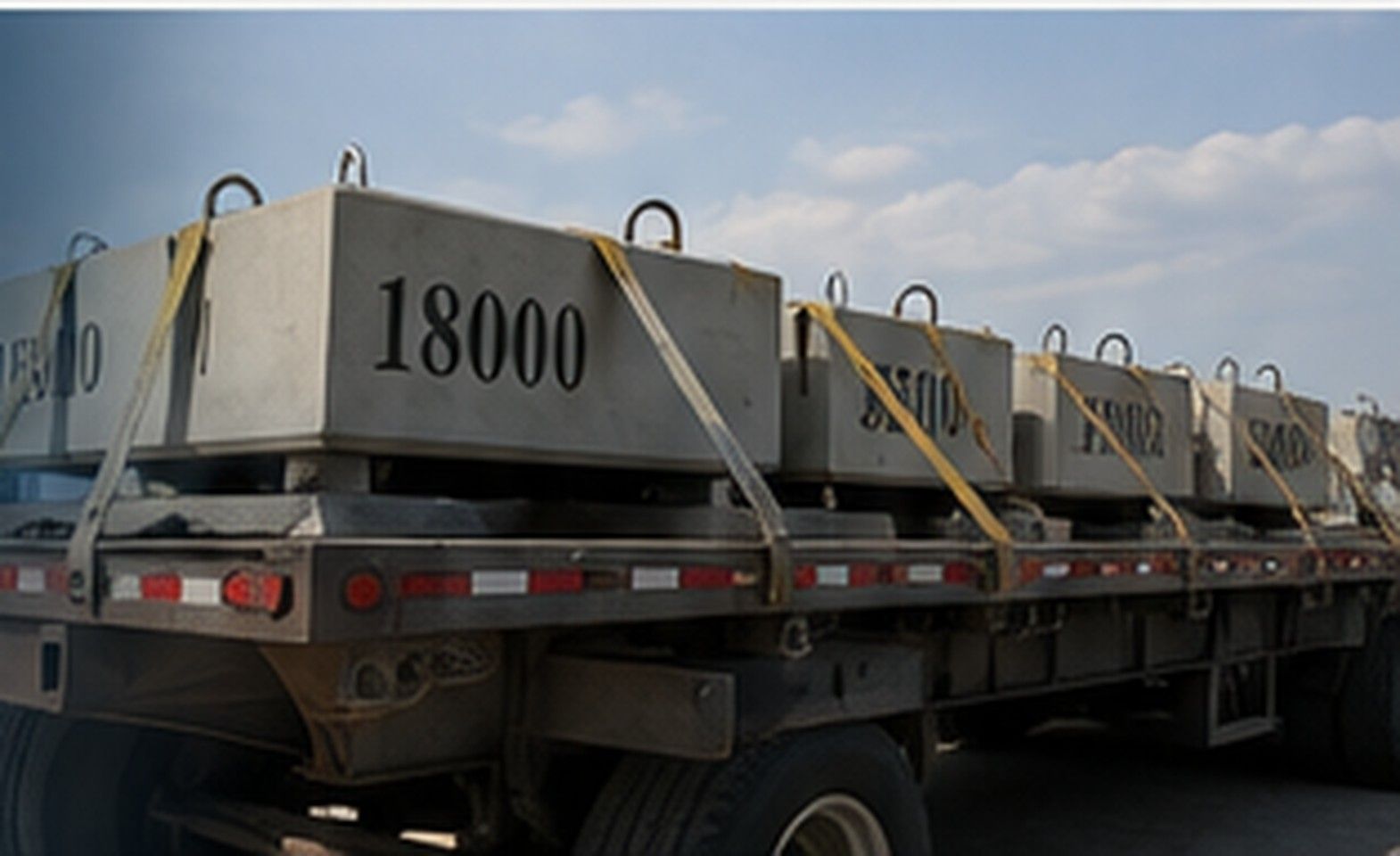 Multiple Amidon Sling Blocks transported on a flatbed trailer